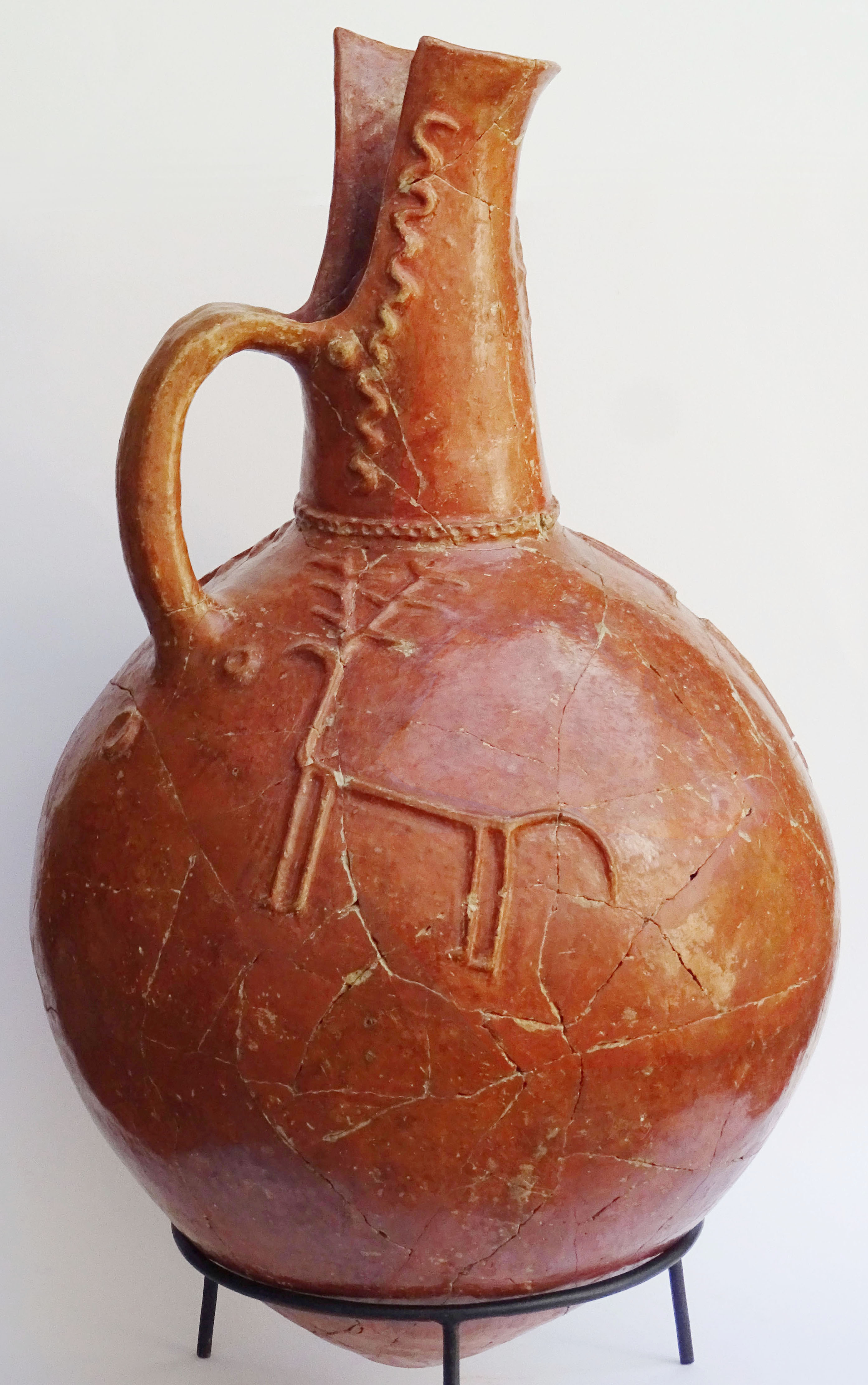 very large jug with 2 stags, 2 (goats ?) and snakes